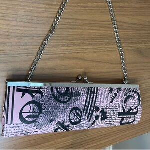 ASOS pink newsprint clutch